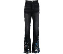 Schlagjeans mit Farbklecks-Print