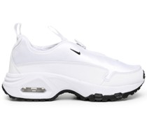 x Nike Sneakers mit Swoosh