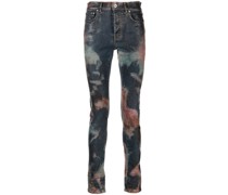 spray-pattern slim-fit jeans