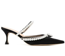 Mules mit verzierten Riemen