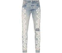 Skinny-Jeans mit Hibiskus-Print