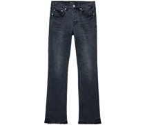 Ausgeblichene Schlagjeans