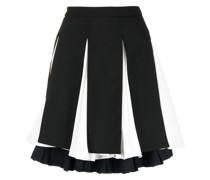 Faltenrock im Layering-Look