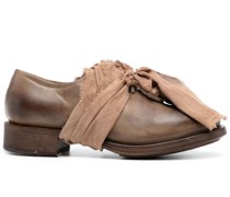 faded lace-up leather shoes