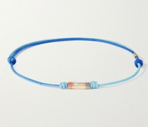 Armband aus Gold, Emaille und Kordel