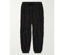 Schmal zulaufende Hose mit Kordelzugbund aus Jacquard-Strick aus einer Baumwollmischung