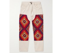 Schmal zulaufende Jeans mit Besätzen