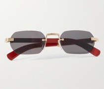Rahmenlose Sonnenbrille mit Holzbügeln und goldfarbenen Details