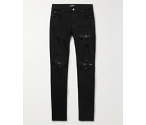 MX1 Skinny Jeans mit Einsätzen in Distressed-Optik