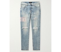 Skinny Jeans in Distressed-Optik mit Logoapplikation
