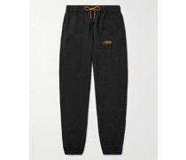 Schmal zulaufende Jogginghose aus recyceltem Shell mit Logoprint