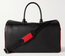 Ruisbuddy Reisetasche aus vollnarbigem Leder mit Gummibesatz und Stachelnieten