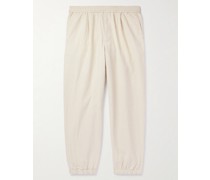 Schmal zulaufende Hose aus Stretch-Baumwoll-Seersucker