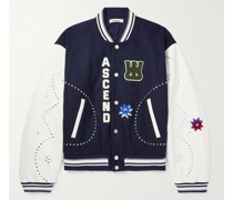Collegejacke aus einer Wollmischung und Leder mit Nieten und Applikationen