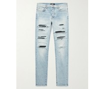 Thrasher Skinny Jeans in Distressed-Optik mit Einsätzen aus Leder