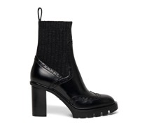 Schwarze Sock-Stiefeletten für Damen aus Leder mit mittelhohem Absatz und Brogue-Details