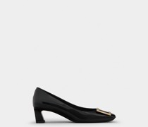 Pumps Trompette aus Lackleder mit Metallschnalle