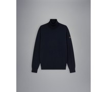 Rollkragenpullover aus Merinowolle mit ikonischem Badge