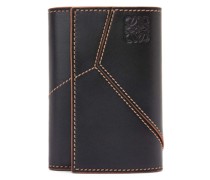 Luxury Puzzle stitches small vertical wallet in smooth calfskin