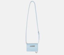 Muenzetui mit Taschenriemen Le Porte aus Leder