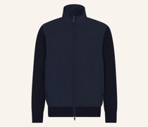Strickjacke im Materialmix
